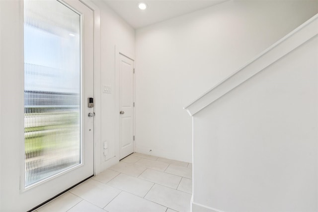 foyer featuring light tile patterned flooring