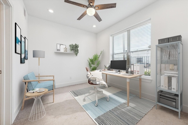 carpeted office with ceiling fan