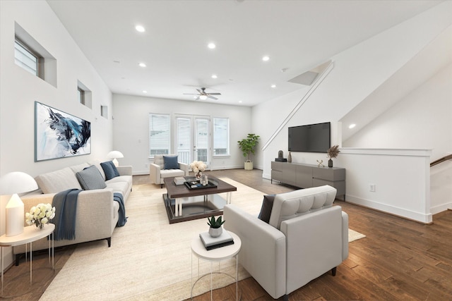 living room featuring hardwood / wood-style flooring and ceiling fan