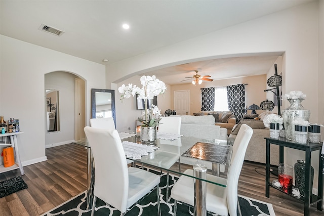 dining room with dark wood-type flooring and ceiling fan