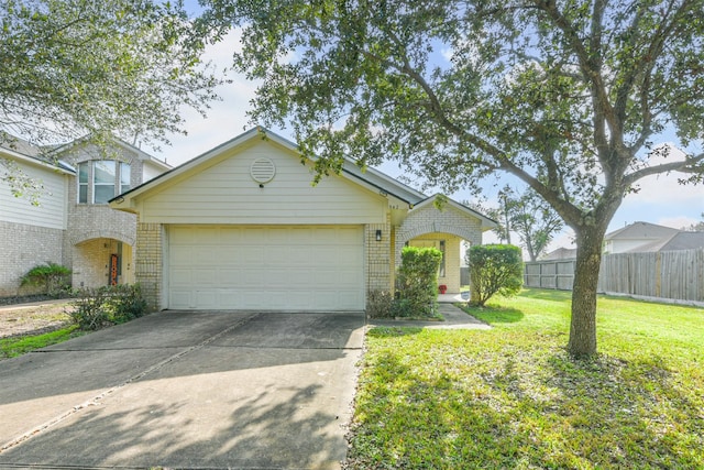 view of front of house featuring a front lawn and a garage