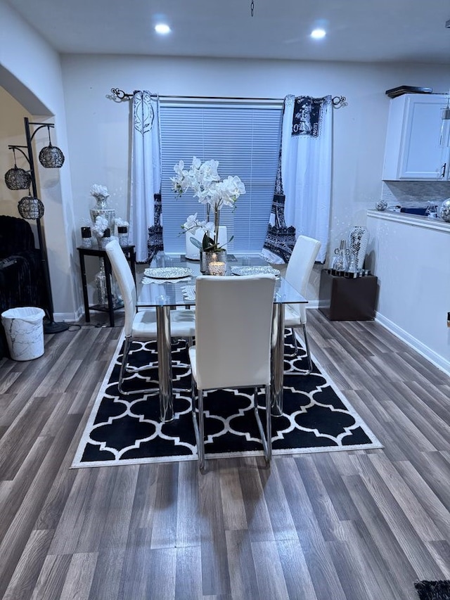 dining space with dark wood-type flooring