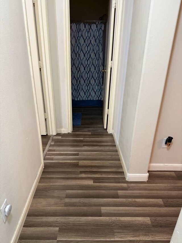 hallway featuring dark hardwood / wood-style floors