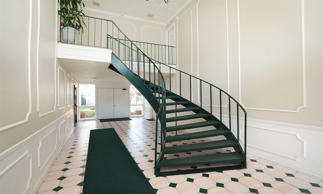 staircase with crown molding