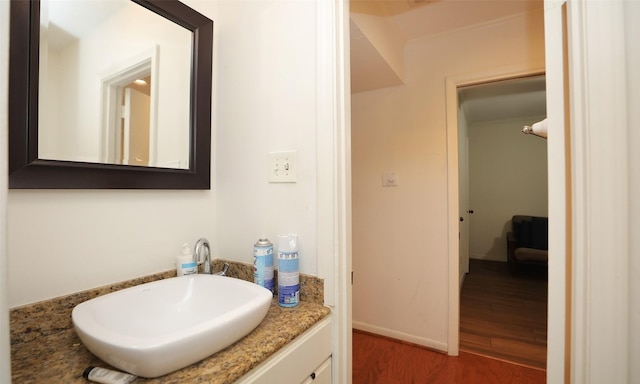 bathroom featuring hardwood / wood-style floors and vanity