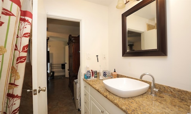 bathroom featuring tile patterned flooring and vanity