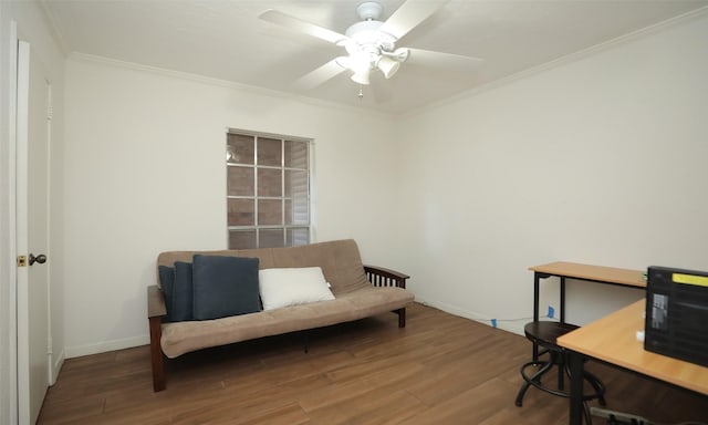 home office featuring hardwood / wood-style floors, ceiling fan, and crown molding