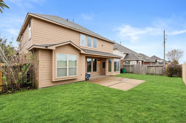 back of property with a patio and a lawn