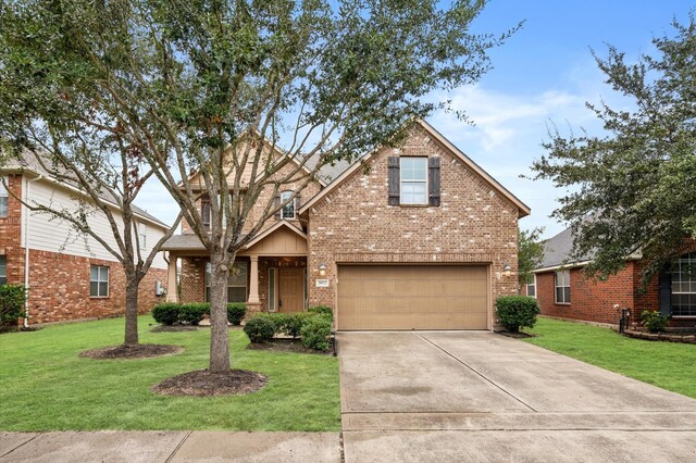 view of front of house with a front lawn and a garage