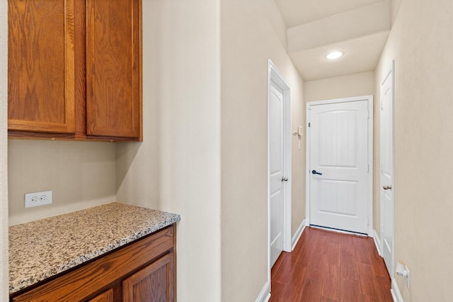 hallway featuring dark wood-type flooring