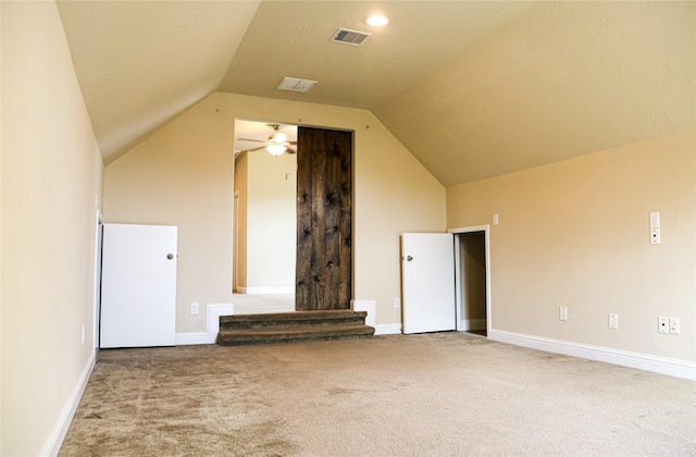 bonus room featuring ceiling fan, lofted ceiling, and carpet flooring