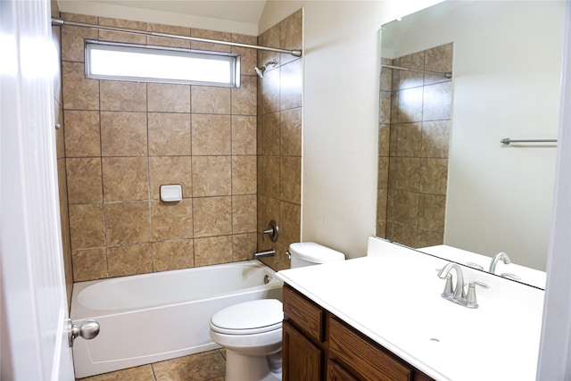 full bathroom featuring lofted ceiling, toilet, tile patterned floors, vanity, and tiled shower / bath combo