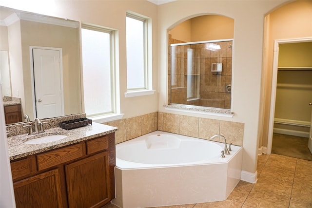 bathroom with vanity, plus walk in shower, and tile patterned floors