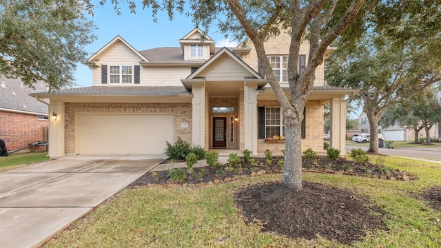 craftsman inspired home featuring a porch, a garage, and a front lawn