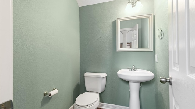 bathroom featuring toilet