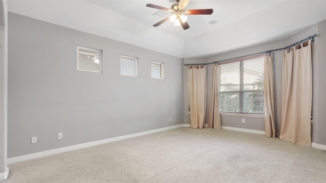 carpeted empty room featuring ceiling fan