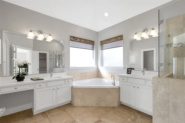 bathroom featuring vanity and plus walk in shower