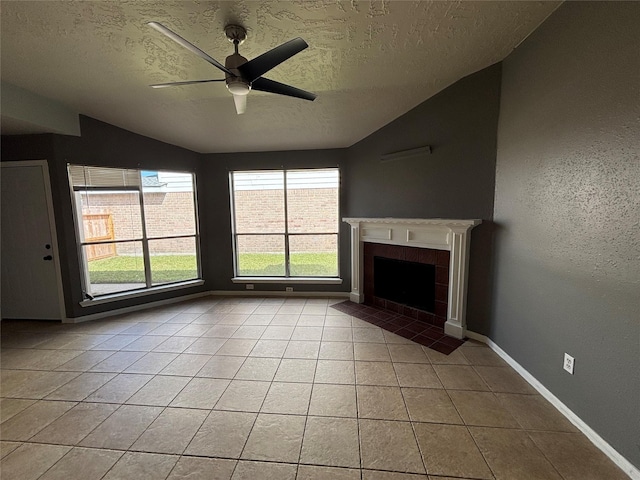 unfurnished living room featuring light tile patterned floors, a textured ceiling, and vaulted ceiling