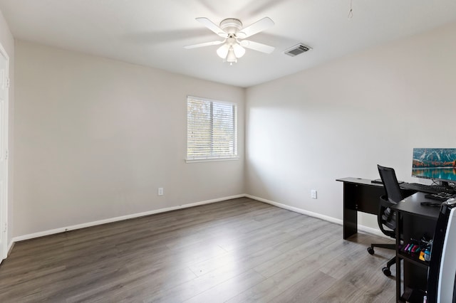 home office with hardwood / wood-style floors and ceiling fan