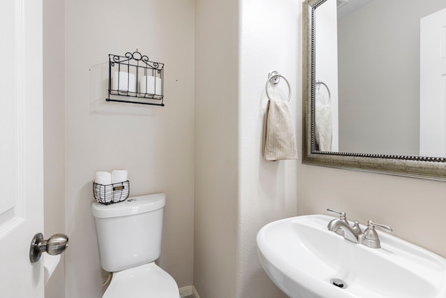 bathroom with toilet and sink