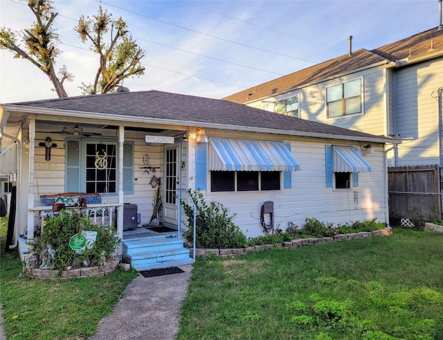 view of front of home with a front yard and a porch