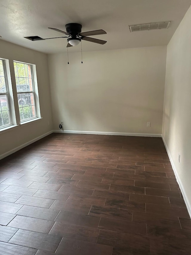 unfurnished room featuring ceiling fan and dark hardwood / wood-style floors