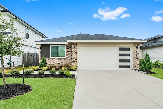 view of front of house with a front lawn and a garage