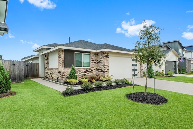 view of front of house with a garage and a front lawn