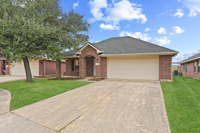 single story home featuring a front lawn, central AC unit, and a garage