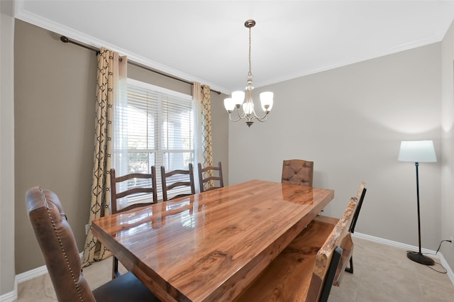 tiled dining space with an inviting chandelier and ornamental molding