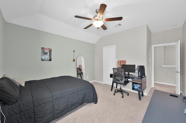 carpeted bedroom featuring vaulted ceiling and ceiling fan