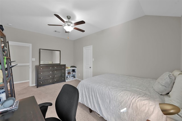 carpeted bedroom featuring ceiling fan and vaulted ceiling