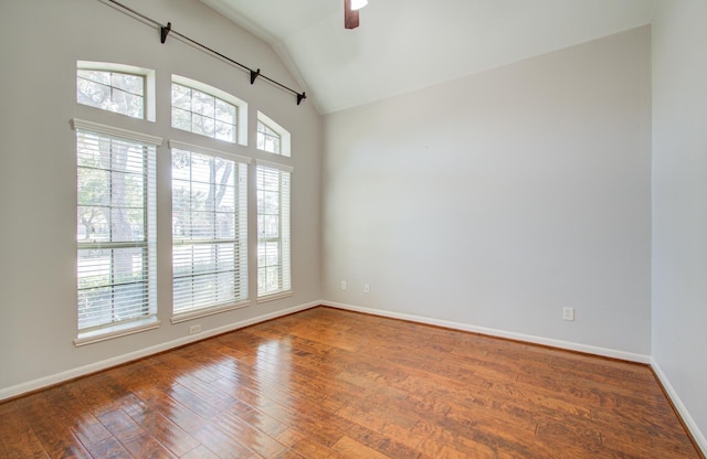 unfurnished room with ceiling fan, wood-type flooring, and vaulted ceiling