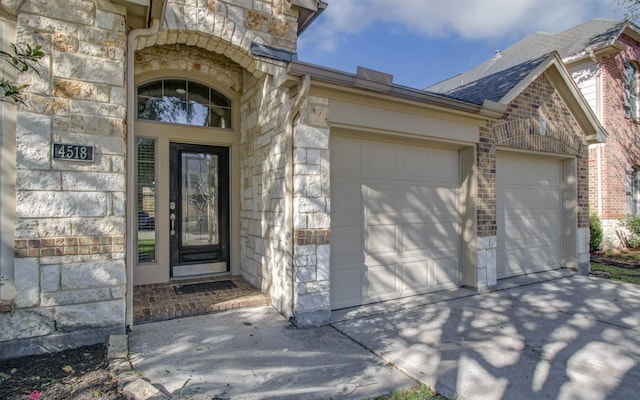 entrance to property featuring a garage