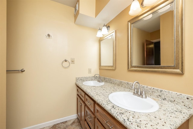 bathroom with tile patterned floors and vanity