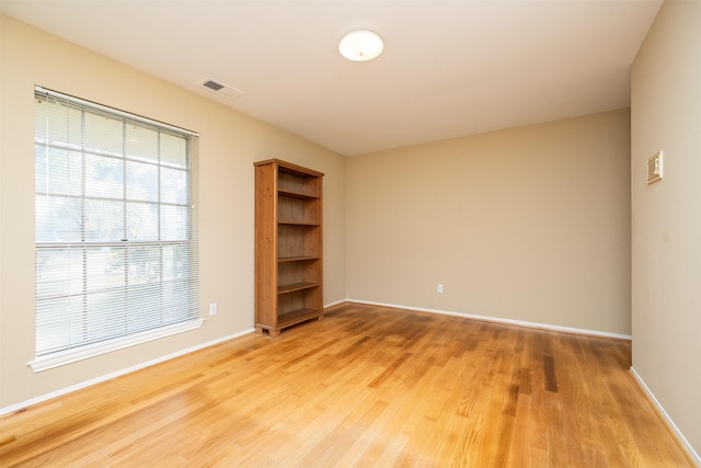 spare room featuring hardwood / wood-style flooring