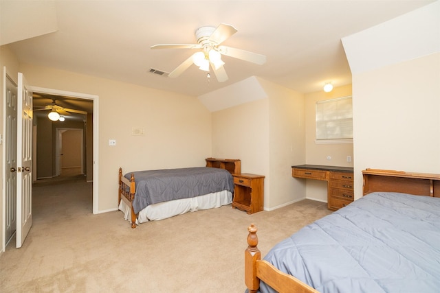 bedroom with ceiling fan, lofted ceiling, and light carpet