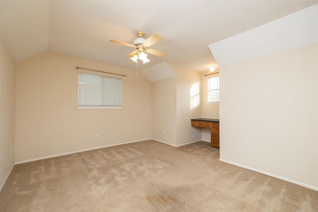 bonus room with ceiling fan, light colored carpet, and lofted ceiling