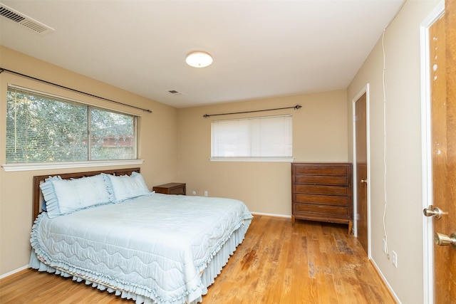 bedroom with wood-type flooring