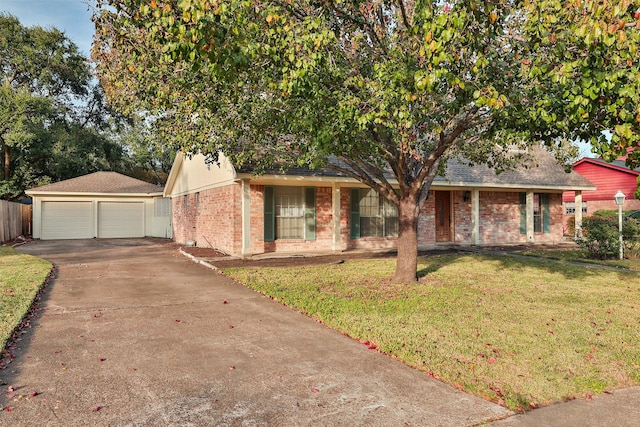 view of front of home with a garage and a front yard