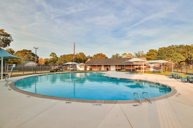 view of swimming pool featuring a patio area