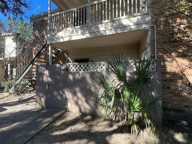 view of home's exterior with a balcony