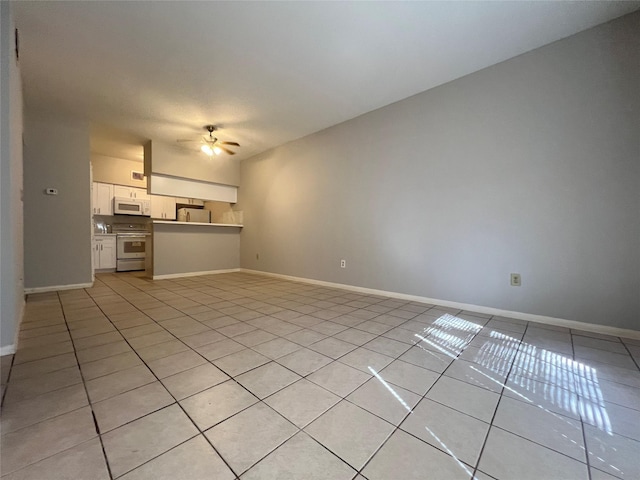 unfurnished living room with ceiling fan and light tile patterned floors