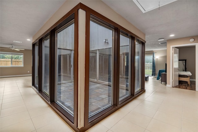 hallway featuring light tile patterned floors