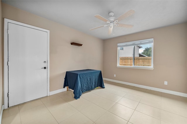 unfurnished bedroom featuring ceiling fan and light tile patterned floors