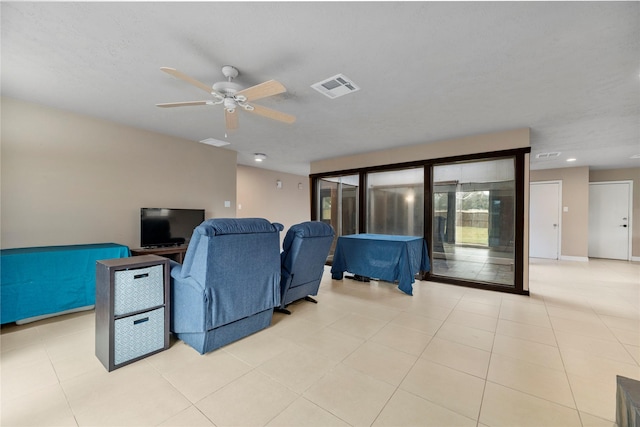 living room featuring ceiling fan