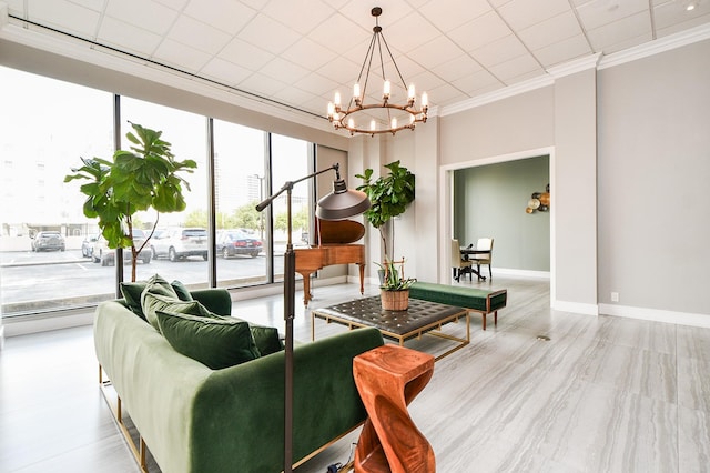 living room featuring a chandelier, light wood-type flooring, and ornamental molding