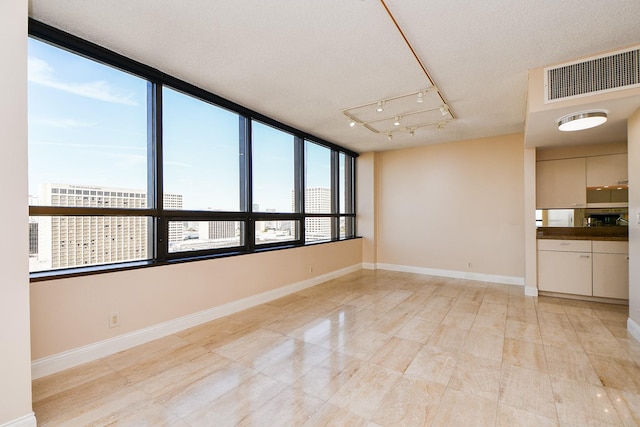 empty room featuring a textured ceiling