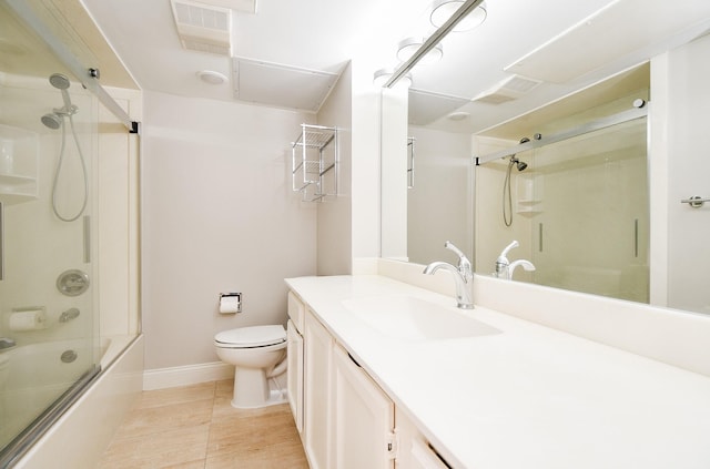 full bathroom with shower / bath combination with glass door, tile patterned floors, vanity, and toilet