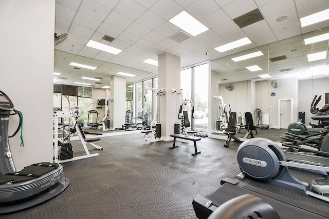 workout area featuring a paneled ceiling